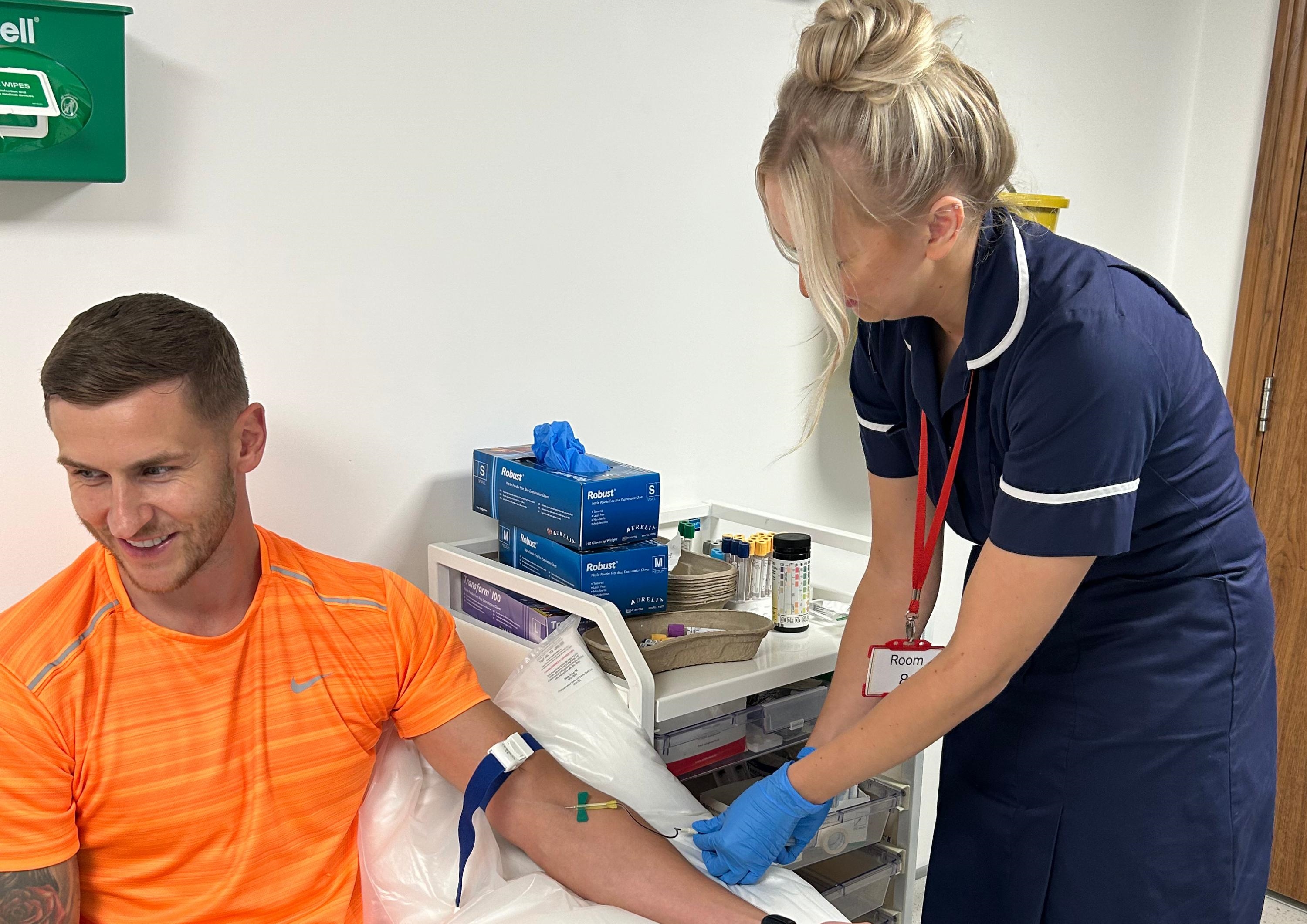 man having a blood test man having a blood test